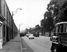 General view of Penistone Road looking towards Broughton Road and Burrowlee Road with Hillsborough Park and bus shelters (right)