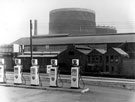 Service station, Penistone Road between Balaclava Road and Barrack Lane looking across the River Don towards Toledo Steel Works, Neepsend Lane and Neepsend Gas Holder in the background