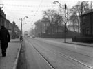 General view of Penistone Road showing properties including No. 858 S. and W. H. Musk, tobacconist with the entrance to Hillsborough Park on the right, 1945-1955