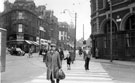 Looking up Pinstone Street from Moorhead, Nelson Hotel, right, Cambridge Street, left, Nos. 102 - 104 Pinstone Street, Hipps (1931) Ltd., tailors and Faie et Cie Ltd., hairdressers