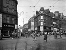 View: s18777 Pinstone Street and Moorhead, looking towards Cambridge Street, Nos. 102 - 104 Pinstone Street, Hipps (1931) Ltd., tailors and Faie et Cie Ltd., hairdressers and No. 2 Moorhead, W.A. Broom Ltd., bakers
