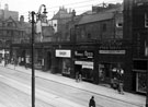 Pinstone Street showing remains of Empire Buildings, No. 121 Singer Sewing Machine Co., No. 123 Neville Reed, No. 125 Peter Hebden, cycle agent Pinstone Street showing remains of Empire Buildings, No. 121 Singer Sewing Machine Co., No. 123 Neville Reed, No. 125 Peter Hebden, cycle agent
