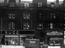 View: s18783 Pinstone Street, Nos. 127 - 131 H.H.B. Sugg Ltd., sports outfitters, Cambridge Arcade, No. 135 Barney Goodman, tailors