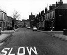 Pomona Street from junction with Pear Street, Sheaf Brewery in background, Rising Sun public house, No 11 Pear Street and No 72 Pomona Street, left