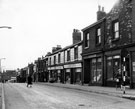 Regent Street looking towards Glossop Road showing Nos. 53 Gladys Burgoin, ladies hairdresser, Nos. 51 - 43 J. C. Shirtcliffe Ltd., outfitters and house furnishers