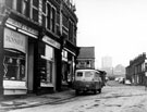 Nos. 6 Frank Denniff, butcher, 4 W. Lambert, greengrocer and 2 F. W. Cartledge and Sons, outfitters, Portland Street looking towards Upperthorpe Hotel (sign with Wiley and Co), No. 159 Upperthorpe Road and Addy Street