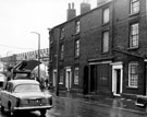Nos.  5, 7, 9 Frank Gregory, butcher and 11 Princess Street looking towards Railway Viaduct over Attercliffe Road