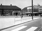 View: s19008 Ridgeway Road and City Road from Mansfield Road after improvements, No. 2, Ridgeway Road, George Owen Ltd., chemists, No. 4 Abbett's, confectioners, Manor Cinema, City Road, right