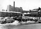 Rockingham Street looking towards Nos. 6 - 14 Canning Street (including former premises belonging to Thomas H. Benton and Co. Ltd., silversmiths, Devonshire Works) and Divison Street (right), Royal Hospital buildings in background