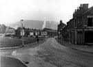 St. Philip's Road from the junction with Dover Street (right) and Bellfield Street (left) looking towards housing awaiting demolition after Hunt Street (left), showing houses remaining on Fountain Square (left)