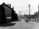 Newhall County Junior School (right), Newhall County Infant School (left) and St. Clements Mission Hall, Sanderson Street looking towards Brightside Lane and Grimesthorpe Works in the background