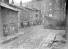 Sambourne Square between Solly Street and Edward Street, with Solly Street the 5 storey wall (3 the other side) at the top of the yard, showing Mr. and Mrs. Yates on the left. Demolished 1927