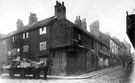 Horse and cart on Grindle Gate looking Nos. 13/15 Gill's wholesale druggist and 17 Ball Inn, Scotland Street
