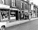 Nos. 412 - 398 Sharrow Vale Road, premises include No. 410 James Coombes and Co. Ltd., boot repairers, No. 406 Handicraft Supplies, No. 402 B. Heffron, confectioners