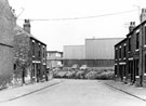 Nos. 5, 7, 9  Clegg and Sergeant, builders, plumbers and property repairers (left) and Nos. 8 - 16 (right), Smith Street, Darnall from Greenland Road