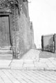 View: s19522 Doorway and side view of F. Fisher and Sons Ltd., cutlery blade forgers, Solly Street (part of which formerly Pea Croft) and alleyway looking towards Scotland street and access to Court 18