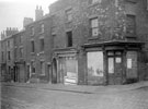Derelict back to back housing and shops, South Street at junction of Gilbert Street, entrance to Court No 9, under arched passage