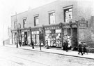 New row of shops replacing Georgian Houses, Nos. 72a, H.W. Kay, printer, 74, H. W. Gibbon, milliner, 76, Elliner, J.T. and G, pharmacist, 78, E. Goddard, dressmaker, 80a, James Schofield and Sons, boot, Spital Hill