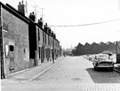 Derelict No. 88 (extreme left) Alfred Road and Nos. 7, 9, 11 etc., Stamford Street looking towards Paget Street and Premier Works, Clixby Road