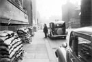 Surrey Street, World War II, sandbags outside Central Library. Leader House, right with chauffer T. Walter Hall standing by the car