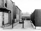 Nos. 11, 10, 9 and 8, Stanley Place, Carbrook with No. 378 Bright Street boarded up shop in the foreground