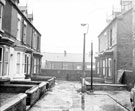 View: s19797 Nos. 5 (nearest camera), 6, 7 and 8 (left) and Nos. 11 (nearest camera), 10 and 9 (left), Stovin Terrace, Darnall  looking towards John Guy and Co. Ltd., sheep shear manufactuters, Cymric Works