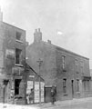No. 20 Sylvester Street showing derelict back to back houses and shop, left, No. 12 Albion Inn, right