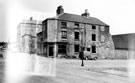 Thomas Street (right) at junction of Bath Street showing derelict back to back housing. Clarence Works and entrance to Court 1, in background