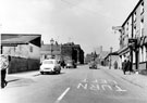 View: s19919 Thomas Street, junction with Milton Lane and No 80, Herbert Day, wheel repairer, left. Premises on right include Castleburn Motors Ltd., motor agents and No 125, Sportsman's Inn