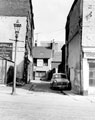 View: s19922 Thomas Street looking towards rear of the Peacock Inn, fronting Nos. 198 - 200 Fitzwilliam Street. Marshall Bros. Ltd., coffin furniture manufacturer, left, this was formerly Court 15