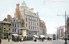 View: s19962 Fargate from Town Hall Square. Queen Victoria Monument, centre, premises on left include No. 70 Charles A. George, chemists and Bank Chambers