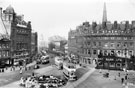 View: s19971 Elevated view of Town Hall Square and Fargate, including No. 66, Fleur de Lys public house, (Bovril sign) and Bank Chambers, left. Albany Hotel and Yorkshire Penny Bank, right. Town Hall Square Rockery in foreground