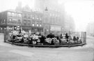 View: s19998 Town Hall Square; Fargate in background including including No. 70 Sheffield Creameries Ltd. (corner of Leopold Street) and No. 68 Loxley Brothers Ltd., printers, No. 66 Fleur de Lis public house, (Bovril sign)