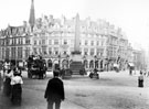 View: s20000 Queen Victoria's Jubilee Monolith, Town Hall Square. Carmel House, Albany Hotel, Fargate and Montgomery Hall, Surrey Street, in background