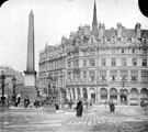 View: s20001 Fargate and Town Hall Square. Jubilee Monolith, left, Albany Hotel, Yorkshire Penny Bank and Carmel House, right