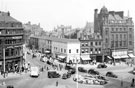 View: s20017 Town Hall Square and rockery, looking towards Leopold Street and Fargate, premises include Wilson Peck, No. 70 Fargate, H.L. Brown and Son Ltd., jewellers, No. 68 Cantors, No. 66 Dean and Dawson Ltd., travel agents and Bank Chambers