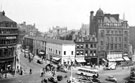View: s20018 Town Hall Square and rockery, looking towards Leopold Street and Fargate, premises include Wilson Peck, No. 70 Fargate, H.L. Brown and Son Ltd., jewellers, No. 68 Cantors, No. 66 Dean and Dawson Ltd., travel agents and Bank Chambers