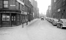Arundel Street at the junction of Arundel Lane, looking towards Howard Street. Nos. 33 - 37 John May (Sheffield) Ltd., Vulcan Works, basket makers. College of Technology, right