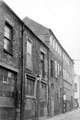 View: s20045 Union Lane showing side view of Nos. 60 - 64 Charles Street, Foxon and Robinson Ltd., packing case manufacturers, junction with Charles Street in background