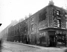 Junction of Button Lane and Trafalgar Street. Nos. 19 - 21 Button Lane, Senior Brothers Ltd., pawnbrokers, on corner. Back to back housing in background (court No 10 was situated behind building in foreground)