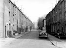 Victoria Street looking towards Jessop Hospital, from Broomspring Lane. Back to back houses and entrance to Court 12, right, back to back houses and entrances to Courts 18, 16 etc., left
