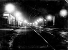 Night view of West Street, looking towards Rockingham Lane showing (left) No. 95 Edith Whitehead, dressmaker