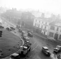 View: s20340 Traffic negotiating the roundabout, West Bar looking towards Paradise Street showing  No. 85 P.J. Wilkinson, printer, Moseley's Arms public house and The Don Picture Palace
