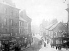 View: s20377 Nos. 5, Spencer Brothers, grocers, 7 J. M.Furness, chemist etc., (left) and Nos. 10, tea dealers, 12 etc. (right) West Bar from the junction with Coulston Street