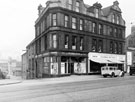 Nos. 60 - 62 J.T. Dobb and Son Ltd., paint manufacturers, 52 - 58 Sugarman Brothers, furniture dealers, West Bar showing Hicks Lane looking towards Spring Street