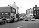 West Bar from Coulston Street looking towards the police station showing Nos. 7 - 9 Sydney's Furnishers Ltd. (left) and Nos. 18 - 20 Kaydon Tobacco Ltd. and 22 - 34, H. Turner and Son Ltd., wholesale newsagent formerly the Blue Boar public house