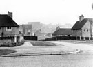 Graves Trust Houses, West Quadrant looking down the footpath towards Firth Park roundabout with St' Hilda's Church in the background