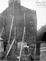 Gable of derelict building, West Street, on block between Pinfold Street and West Bank Lane, (next to Cutlery Handle Manufacturers). The alley, below, right, leads to West Bank Lane