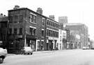 View: s20416 Nos. 104-70 West Street from Bailey Lane junction. Premises include Nos. 100/104 Morton Scissors, scissors manufacturers, No 100, Davidson and Co. (Steel Stamps) Ltd., mark makers, No. 94 Saddle Inn, Nos. 70 - 82 Co-operative Wholesale Society Ltd.