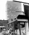 Demolition of houses, Western Bank. Rear of houses fronting Winter Street, centre. University of Sheffield's, Arts Tower in background